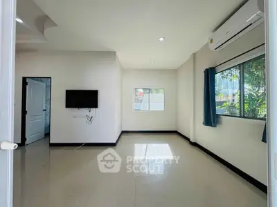 Spacious unfurnished room with air conditioning and natural light