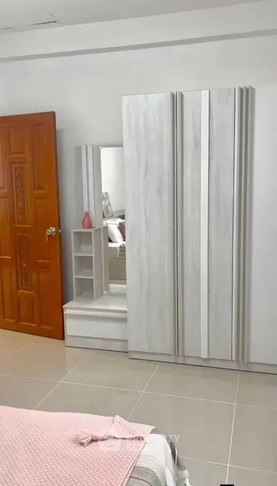 Modern bedroom with sleek wardrobe and stylish decor