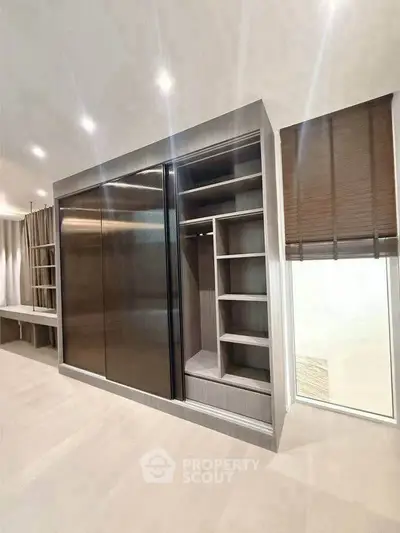Modern built-in wardrobe with sleek design and ample storage space
