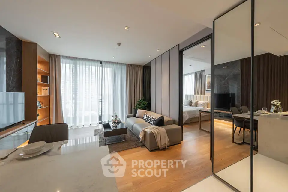 Luxurious modern living room with open layout and elegant decor, featuring a cozy seating area and stylish dining space.