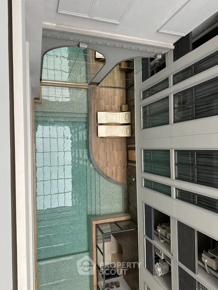 Luxurious modern building interior with glass floors and elegant design elements.