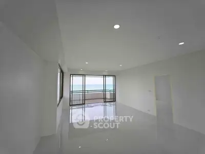 Spacious modern living room with ocean view and large windows