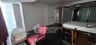 Spacious bedroom with elegant wardrobe and stylish furniture, perfect for modern living.