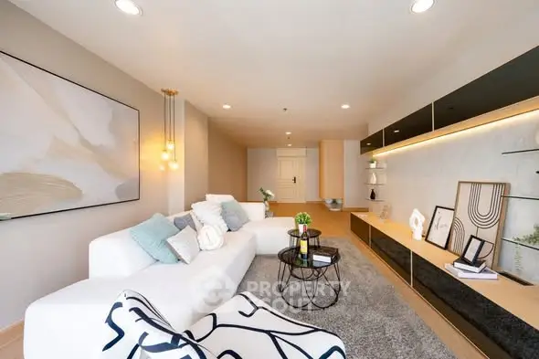 Modern living room with stylish decor and cozy seating area, perfect for relaxation and entertainment.