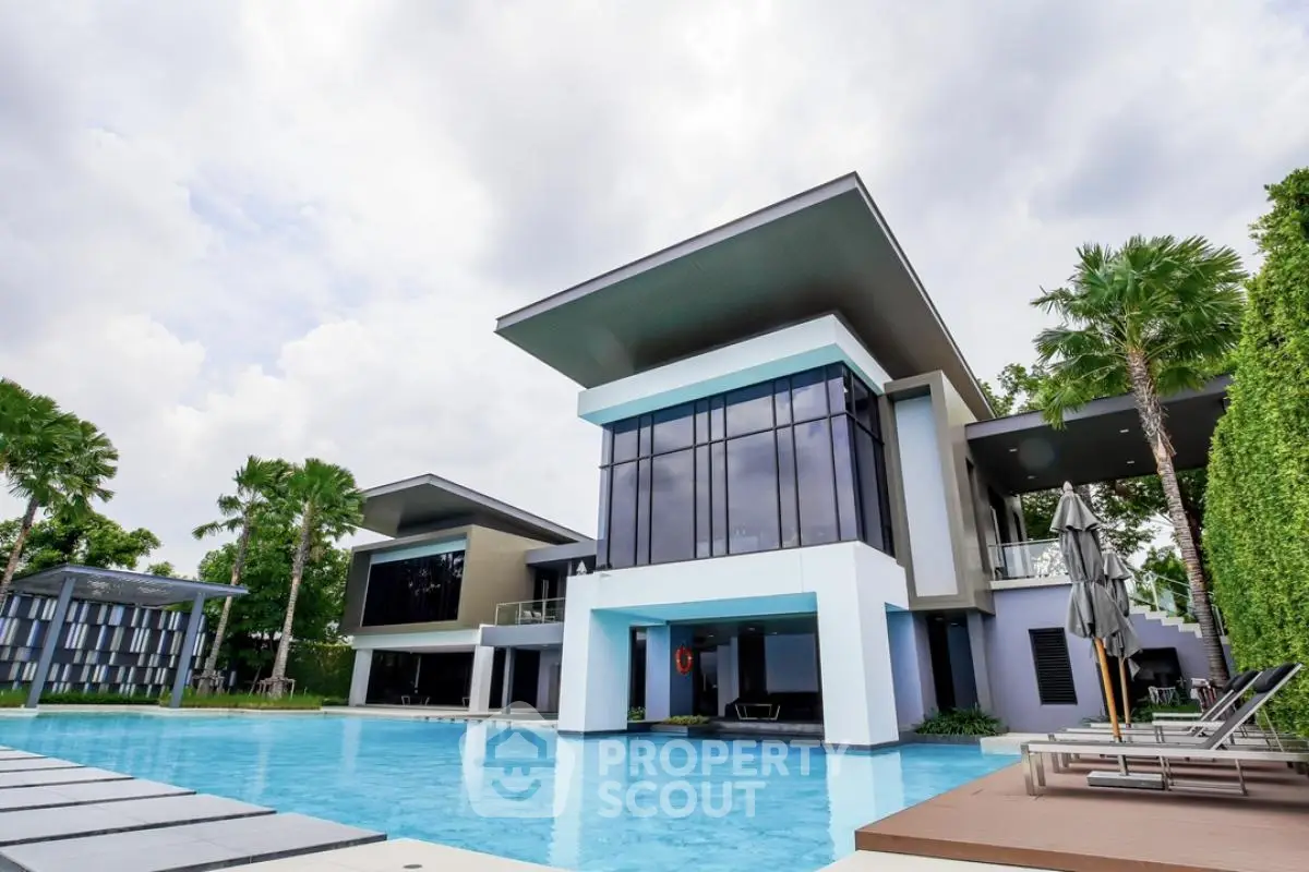 Luxurious modern villa with expansive pool and stunning architectural design.