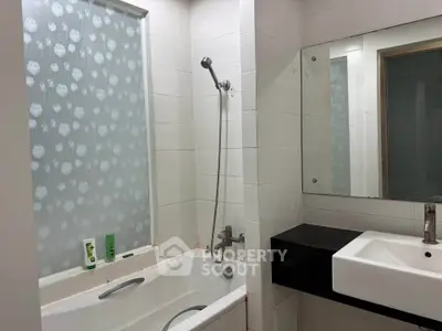 Modern bathroom with bathtub and sleek sink design