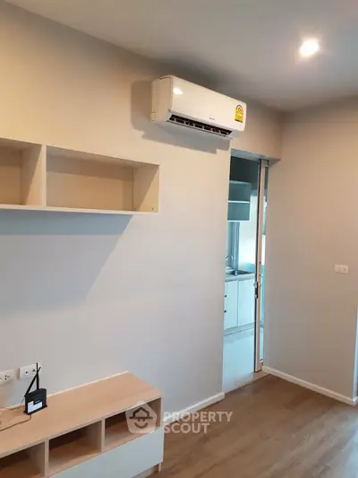 Modern apartment interior with air conditioning and sleek wooden flooring