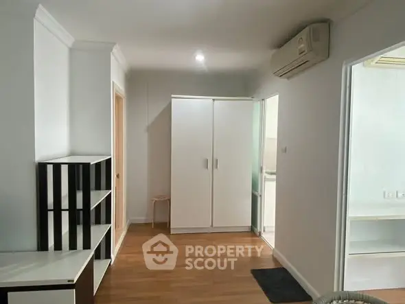 Spacious interior with modern wardrobe and air conditioning, perfect for comfortable living.