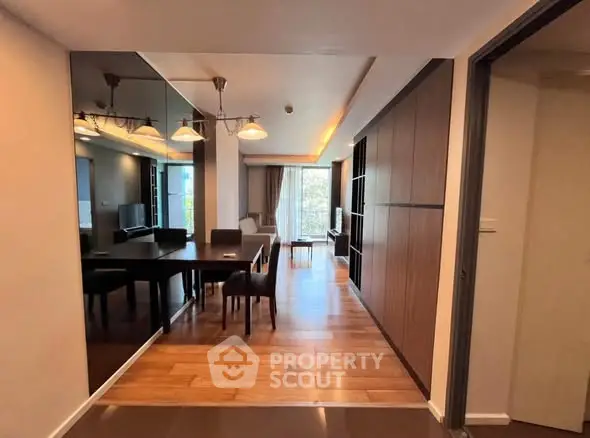 Spacious modern living room with elegant dining area and wooden flooring