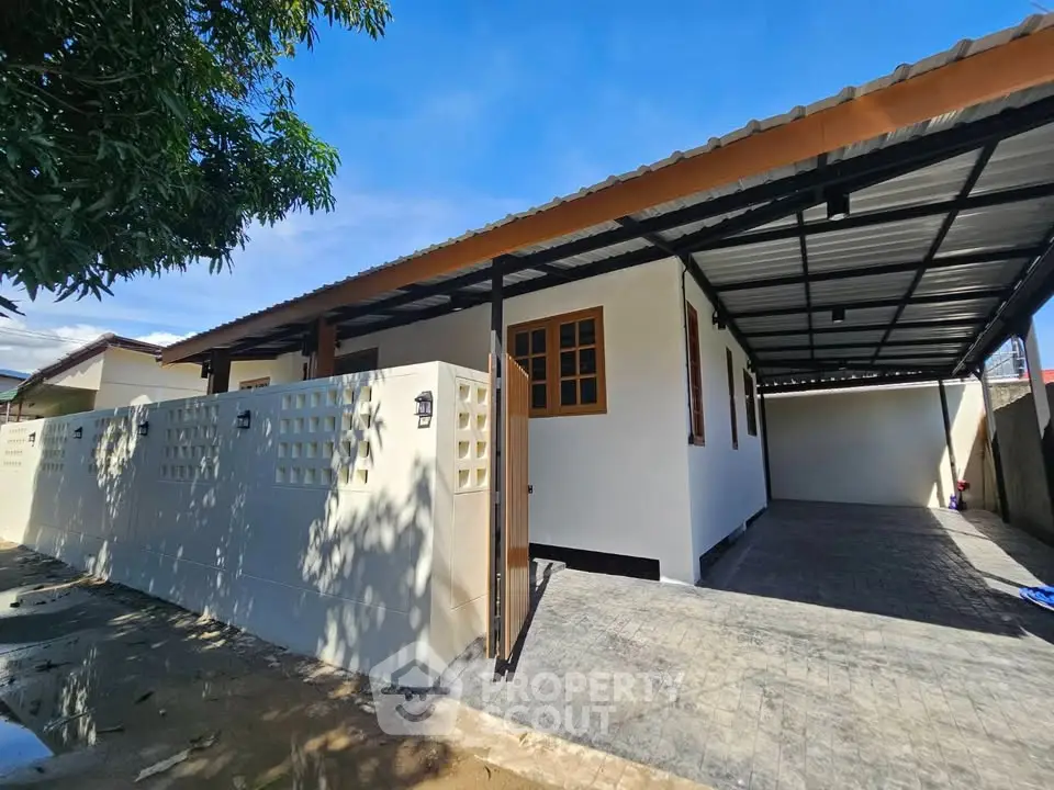 Charming single-story home with covered carport and modern exterior design.