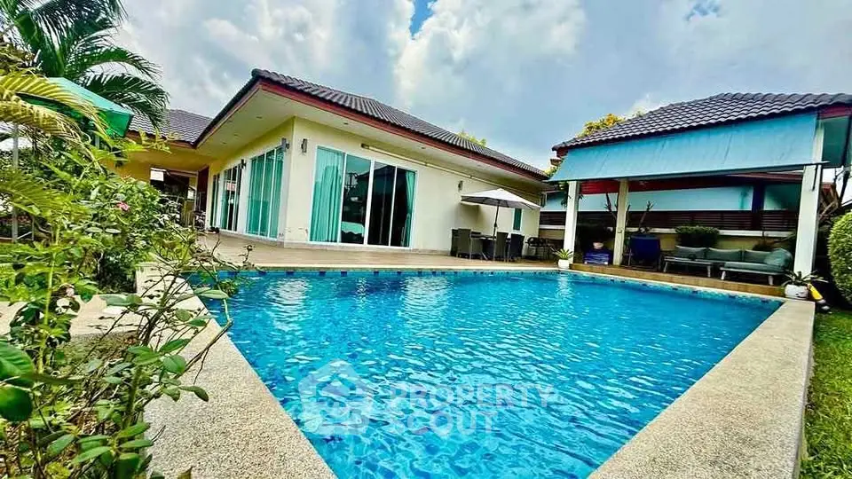 Stunning villa with private pool and lush garden, perfect for luxury living.
