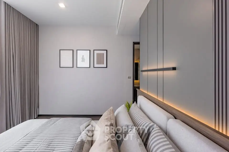Modern bedroom with stylish decor and ambient lighting