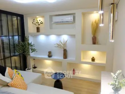 Stylish modern living room with built-in shelves and elegant decor