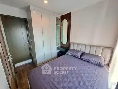 Modern bedroom with sleek wardrobe and stylish decor