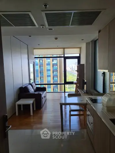 Modern apartment living room with city view and open kitchen layout