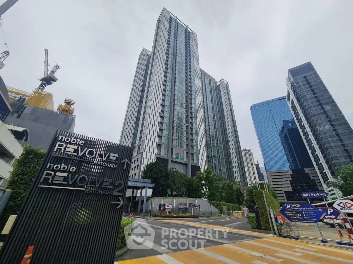 Modern high-rise building with urban skyline and street view
