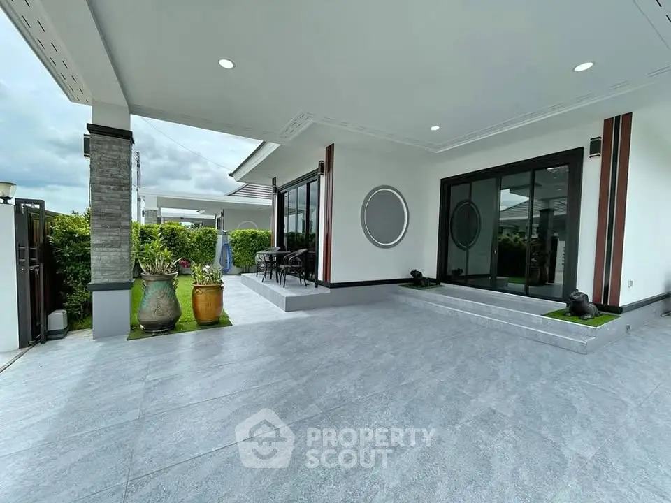 Modern home exterior with spacious patio and stylish design