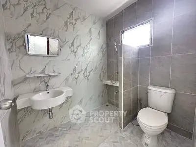 Modern bathroom with elegant marble tiles and sleek fixtures