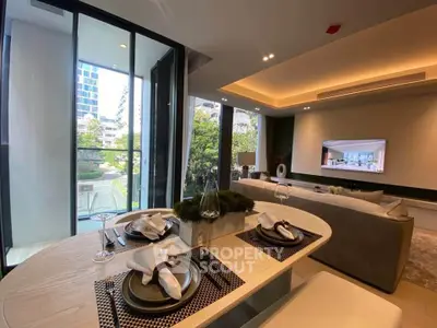 Luxurious modern living room with elegant dining area and large windows offering a stunning view.