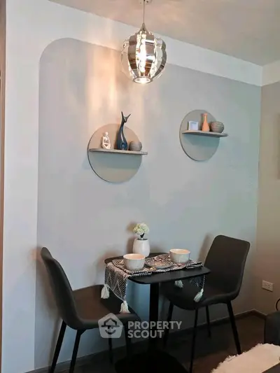 Chic dining nook with modern decor and stylish lighting in cozy apartment