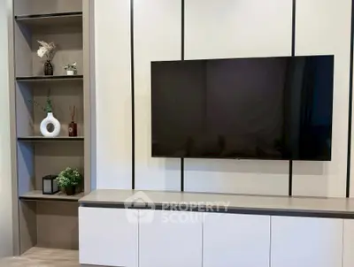 Modern living room with sleek TV unit and stylish shelving