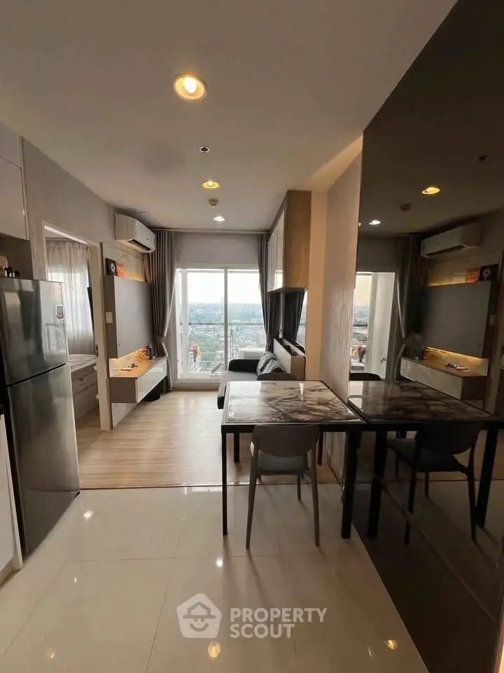 Modern open-plan living room with panoramic city view and stylish furnishings.