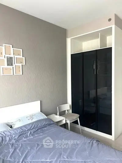 Modern bedroom with sleek wardrobe and stylish decor