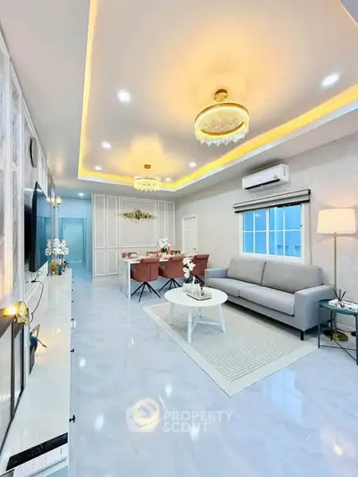Luxurious modern living room with elegant lighting and stylish furniture, perfect for contemporary living.