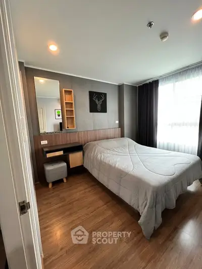 Modern bedroom with stylish decor and natural light