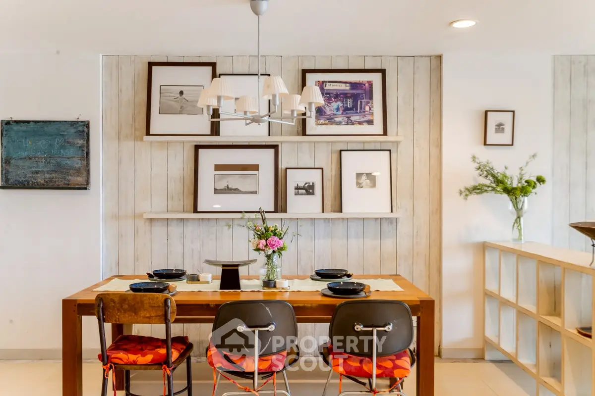 Charming dining area with rustic decor and stylish wall art in a cozy home setting.