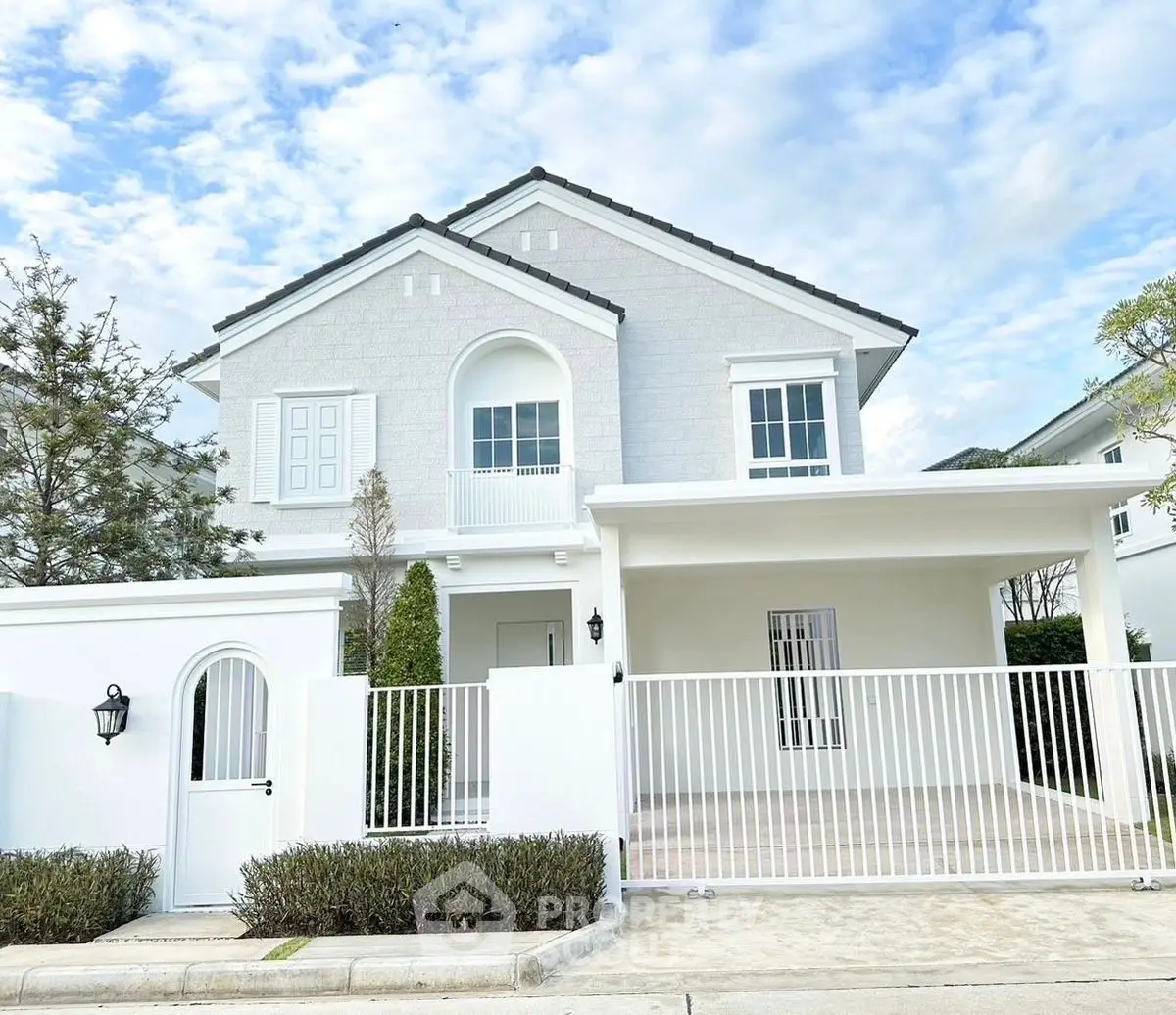 Stunning white modern house with spacious driveway and elegant architecture.