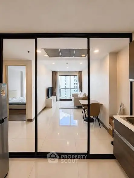 Modern open-layout apartment with sleek kitchen and spacious living area