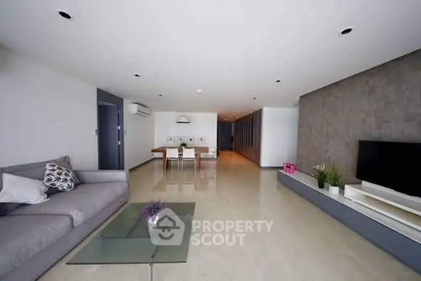 Spacious modern living room with sleek design and elegant furnishings