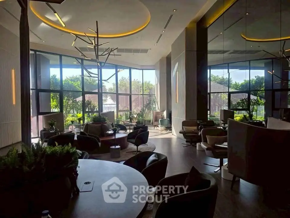 Luxurious modern living room with large windows and stylish furniture, offering a serene garden view.