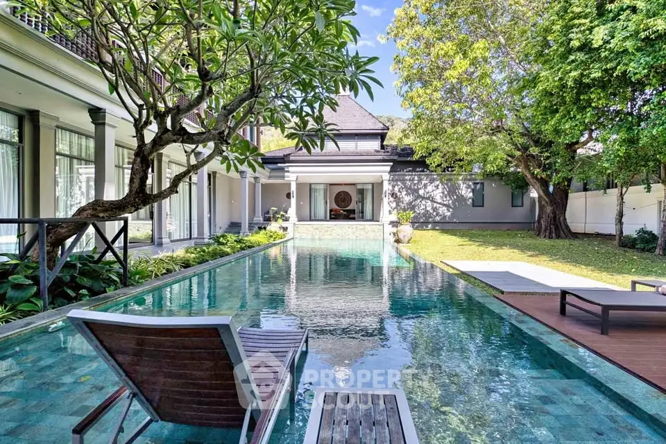 Luxurious villa with stunning pool and lush garden, perfect for relaxation and entertaining.