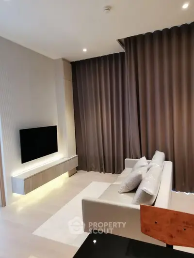 Modern living room with sleek design and elegant curtains