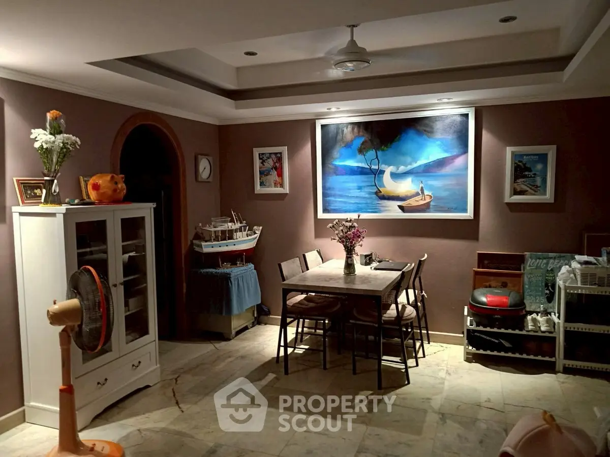 Charming dining area with elegant decor and ambient lighting, perfect for cozy family meals.