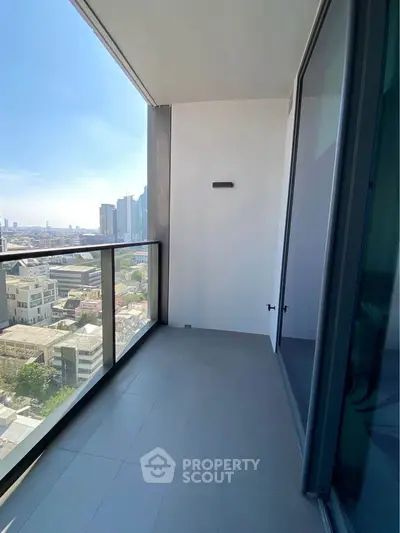 Spacious balcony with stunning city view in modern high-rise apartment