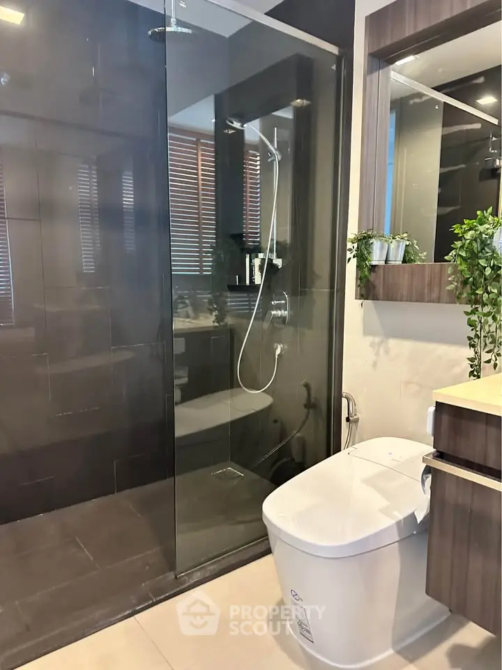 Modern bathroom with glass shower and sleek fixtures