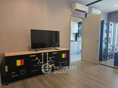 Modern living room with stylish TV stand and air conditioning