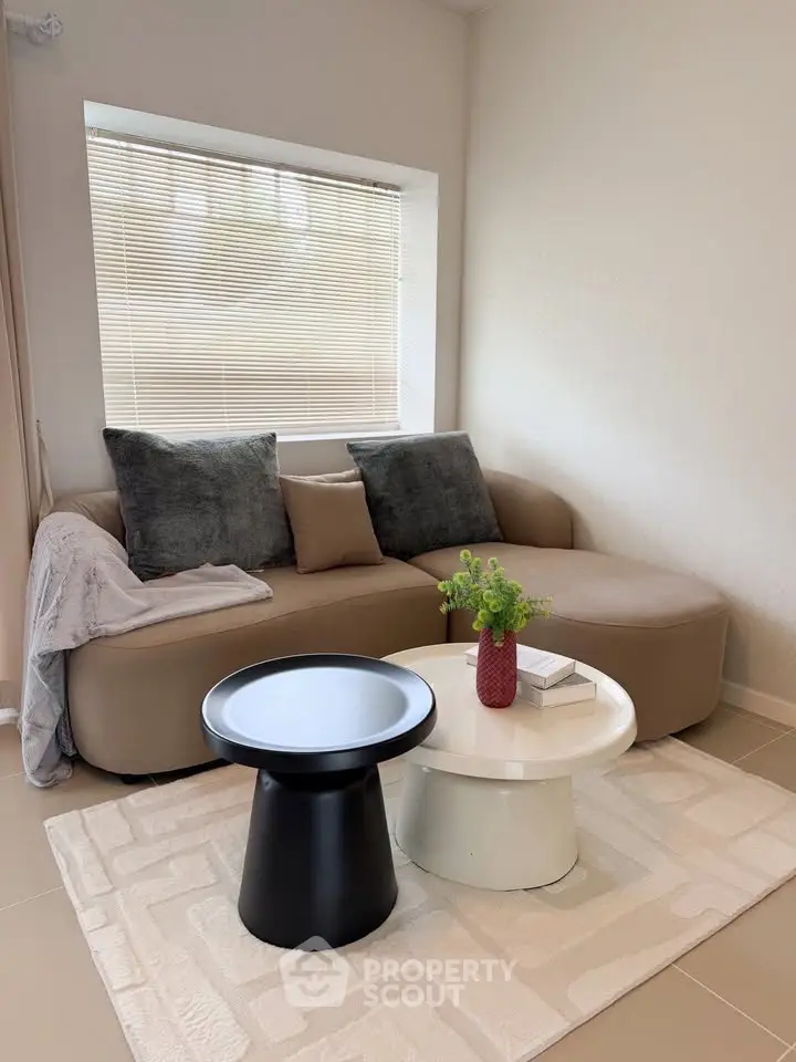 Stylish modern living room with cozy sofa and chic coffee table, perfect for relaxation and entertaining.
