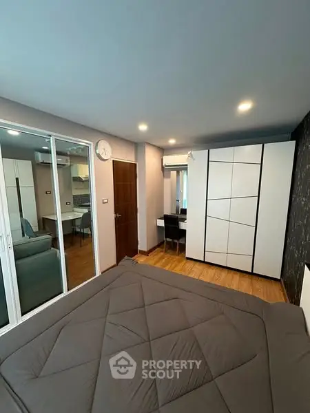 Modern bedroom with sleek design and ample storage space