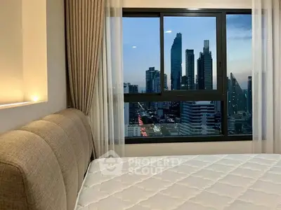 Modern bedroom with city skyline view from large window, featuring cozy bed and elegant curtains.