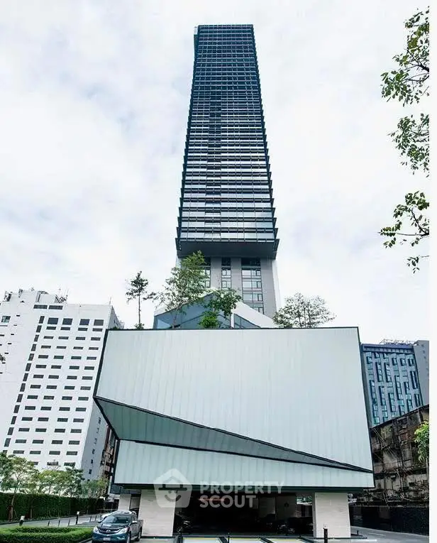 Stunning modern skyscraper with unique architectural design and lush greenery in urban setting.