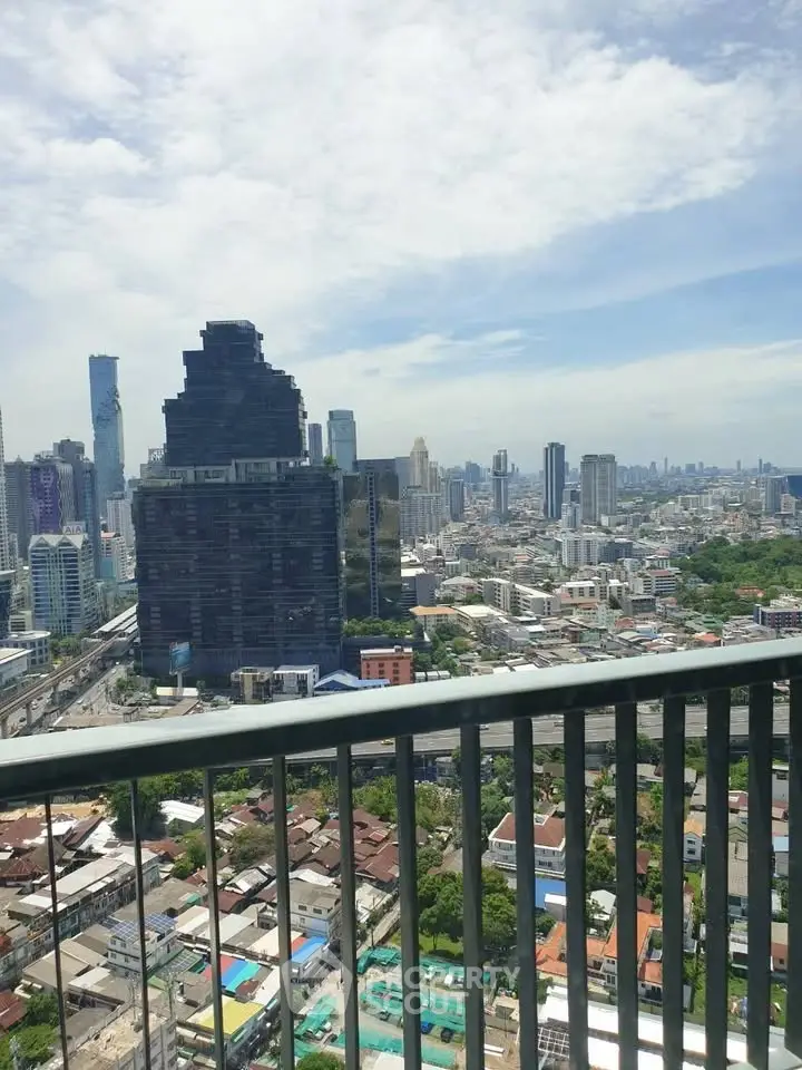 Stunning cityscape view from a high-rise balcony showcasing urban skyline and vibrant city life.
