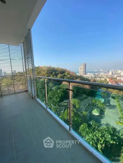 Spacious balcony with stunning city and greenery views, perfect for relaxation and enjoying the outdoors.