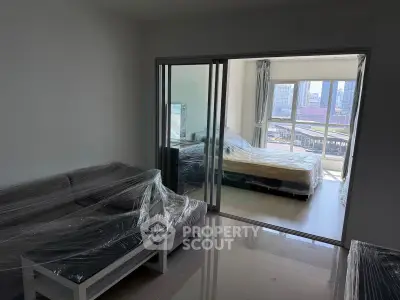 Modern apartment with sliding glass doors and city view balcony