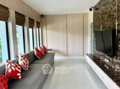 Spacious modern living room with sleek design and large windows