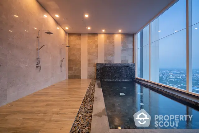 Luxurious indoor pool with stunning city view and modern design