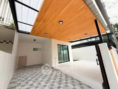 Modern outdoor patio with stylish wooden ceiling and tiled flooring